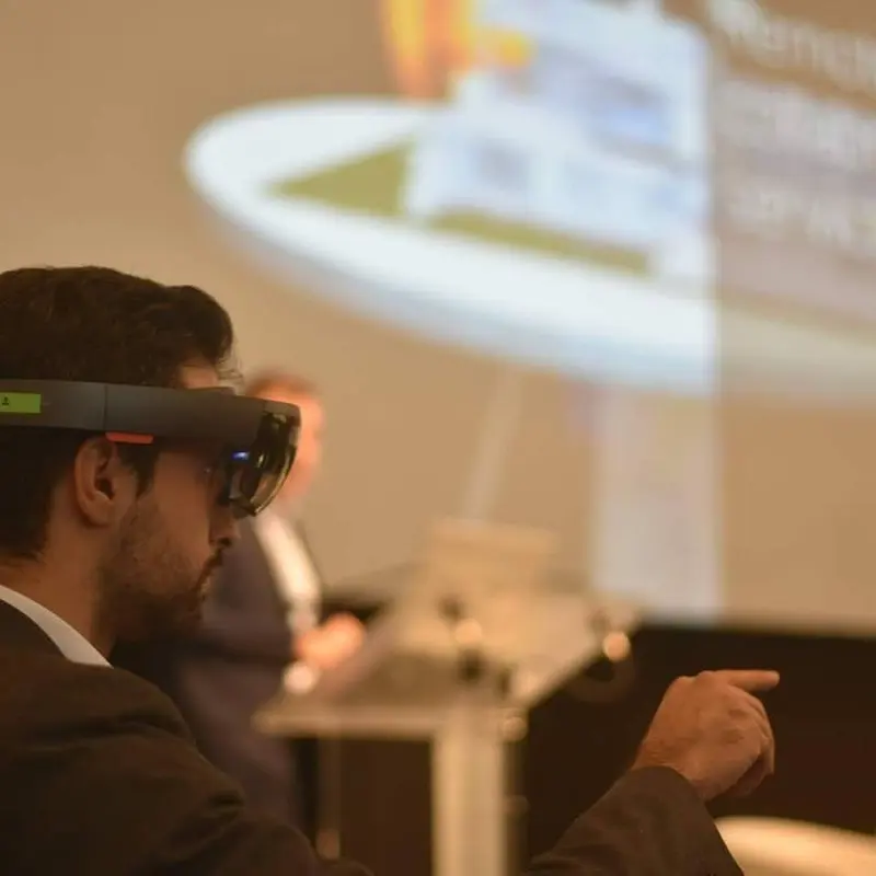 Roberto Mangano wearing HoloLens during a congress session